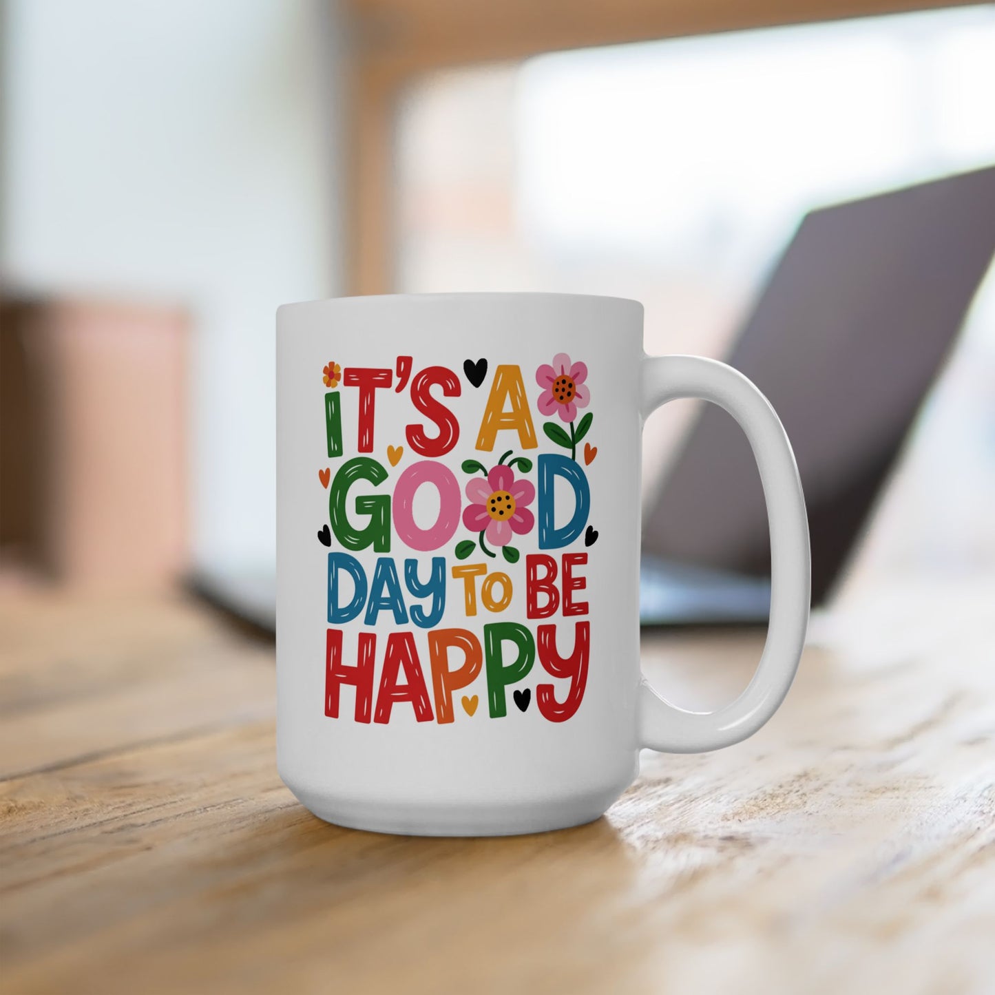 Taza colorida con la frase "Es un buen día para ser feliz"