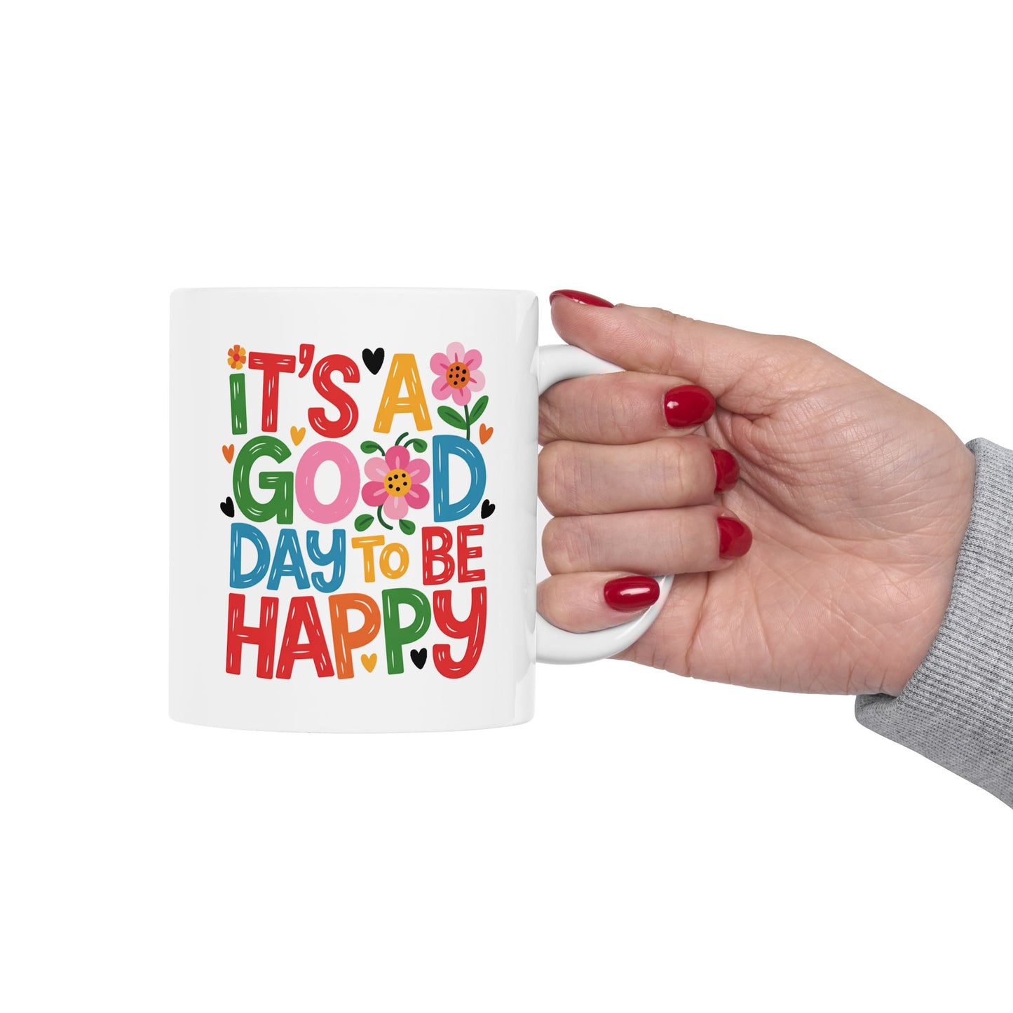 Taza colorida con la frase "Es un buen día para ser feliz"