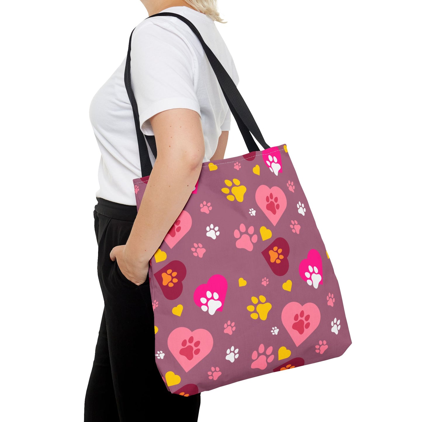 ¡Demuestra tu amor por tus peludos amigos con este clásico bolso de mano con estampado de patas! 🐾