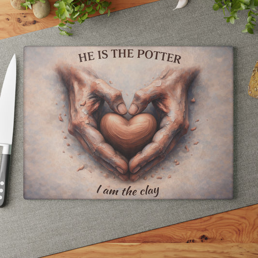 He Is the Potter, I Am the Clay Glass Cutting Board – Faith-Inspired Hands Forming Heart Design