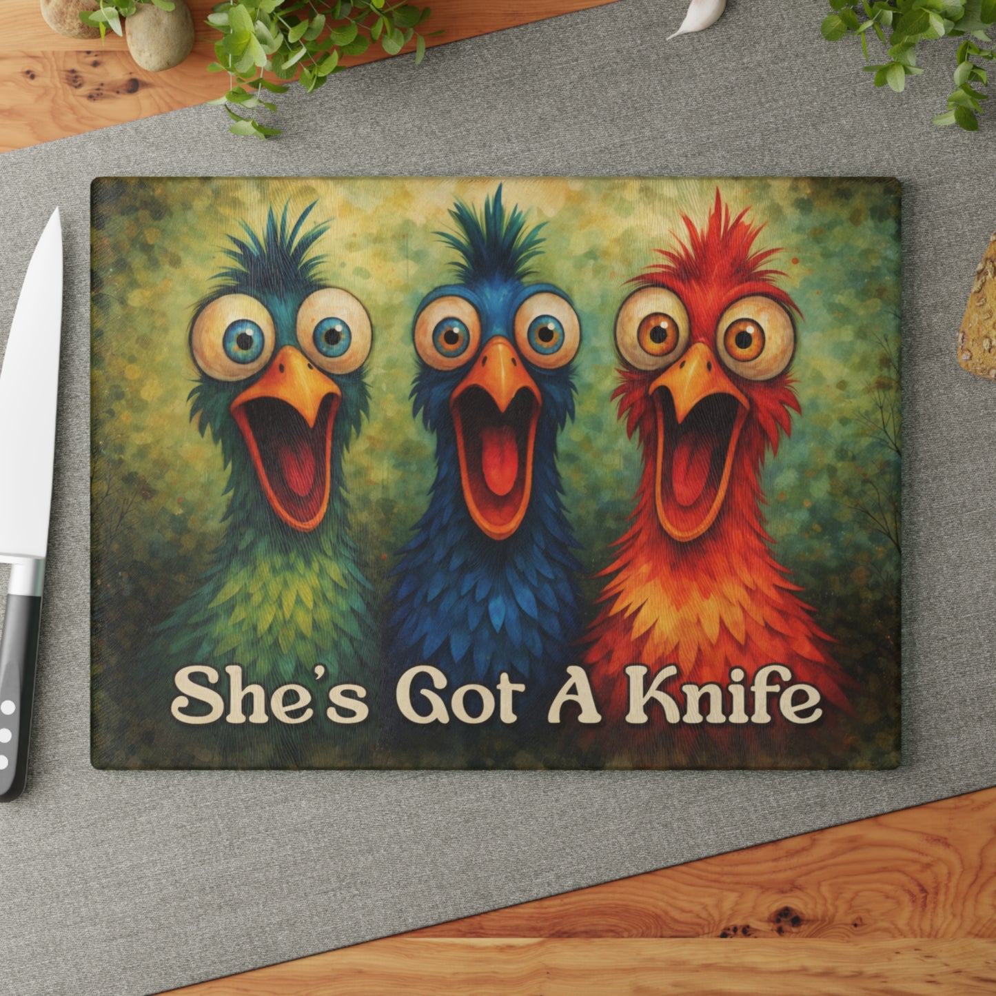 She’s Got a Knife Glass Cutting Board – Colorful Chicken Trio Art with Bold Kitchen Humor