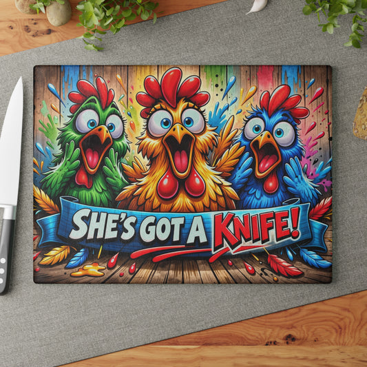 She’s Got a Knife! Glass Cutting Board – Loud Color Chicken Farmhouse Artwork