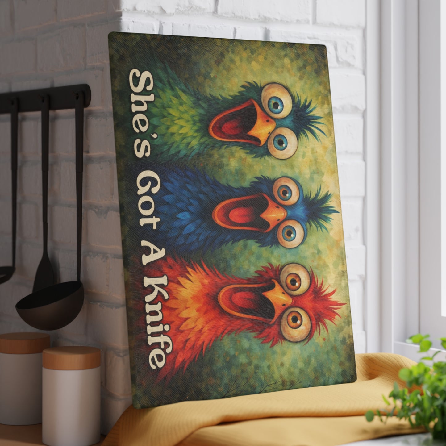 She’s Got a Knife Glass Cutting Board – Colorful Chicken Trio Art with Bold Kitchen Humor