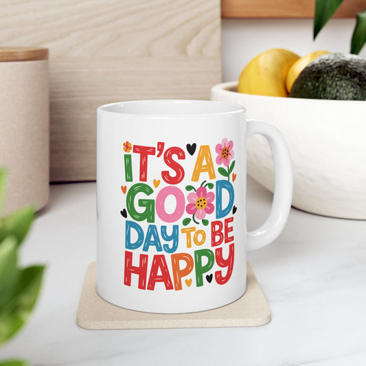 Taza colorida con la frase "Es un buen día para ser feliz"