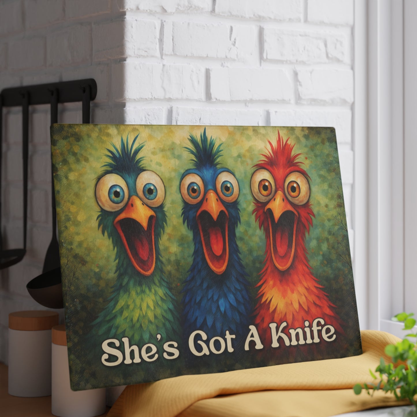 She’s Got a Knife Glass Cutting Board – Colorful Chicken Trio Art with Bold Kitchen Humor